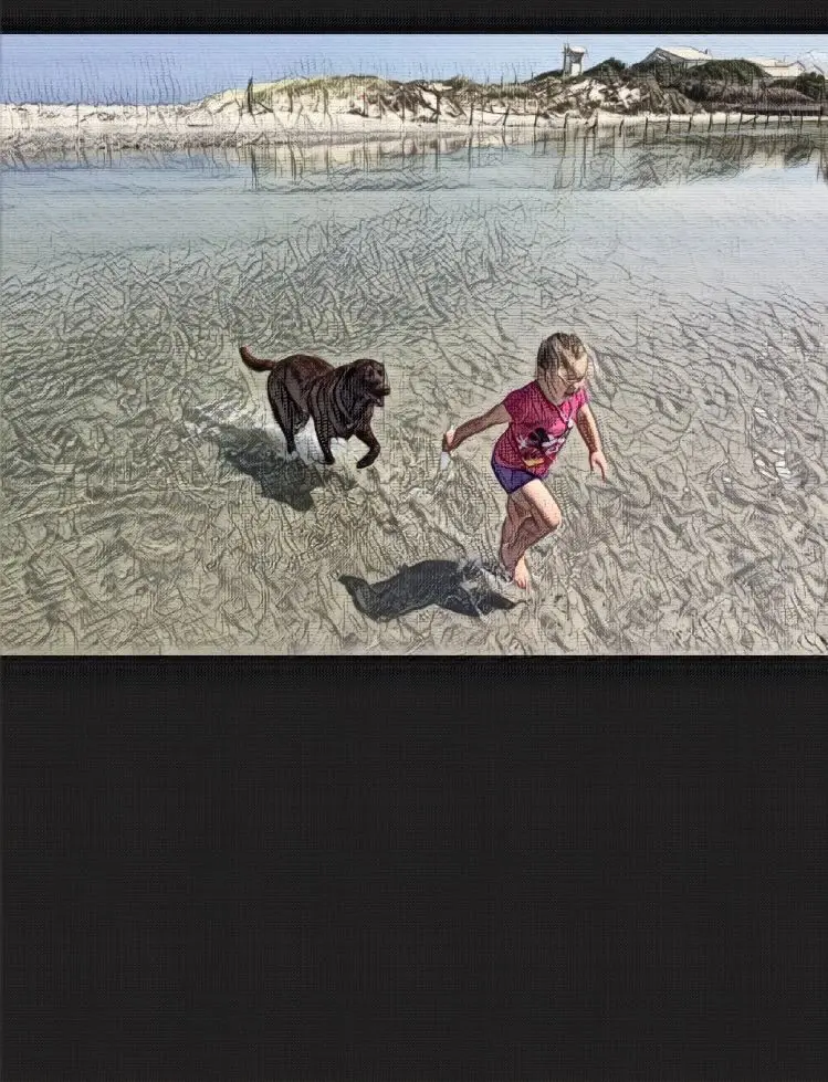 Child and dog running on the beach.